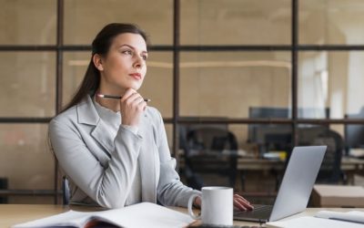 contemplating-businesswoman-sitting-front-laptop-office_23-2148187150